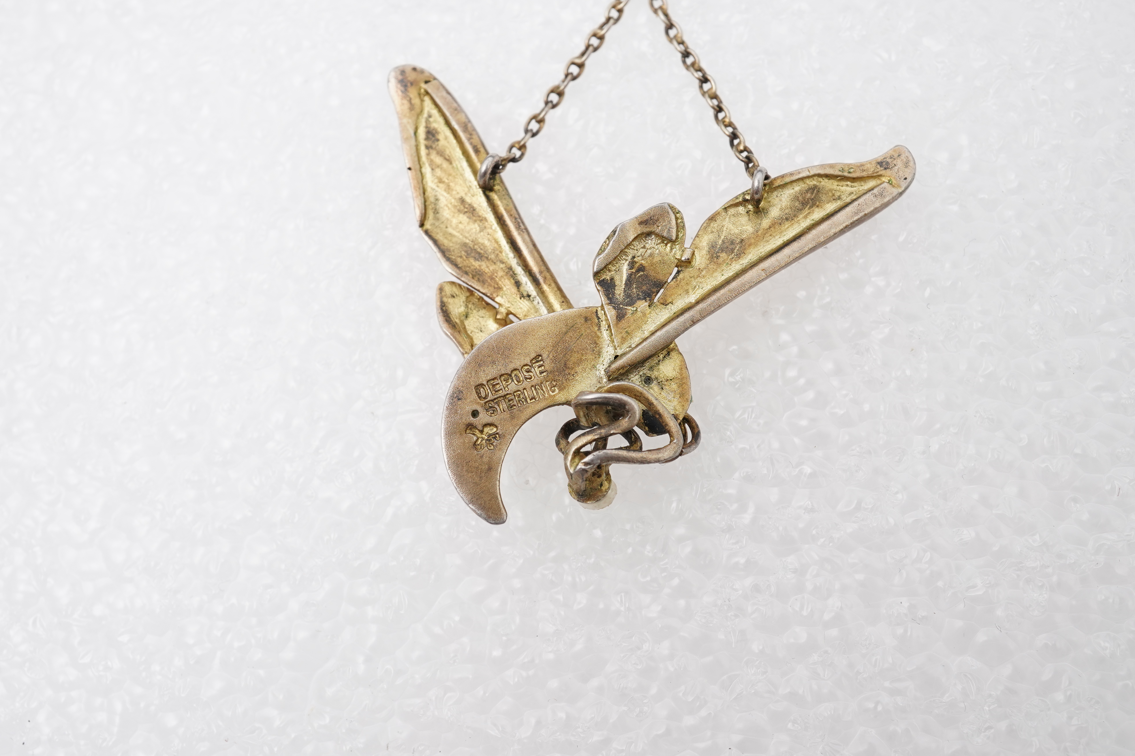 An unusual Art Nouveau silver gilt and enamel pendant, circa 1900